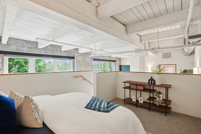 416 NW 13th Ave Unit 312, Portland, OR 97209 - bedroom featuring carpet flooring and wooden ceiling with exposed beams