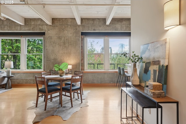 416 NW 13th Ave Unit 312, Portland, OR 97209 - dining room featuring light wood-style floors and wood ceiling with exposed beams