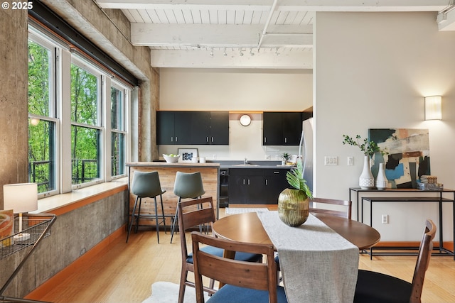 416 NW 13th Ave Unit 312, Portland, OR 97209 - dining area featuring light wood-style flooring, wood ceiling with exposed beams, and track lighting