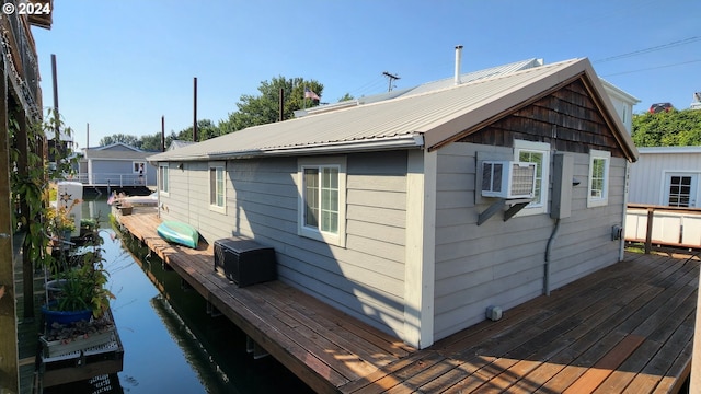 rear view of house with metal roof