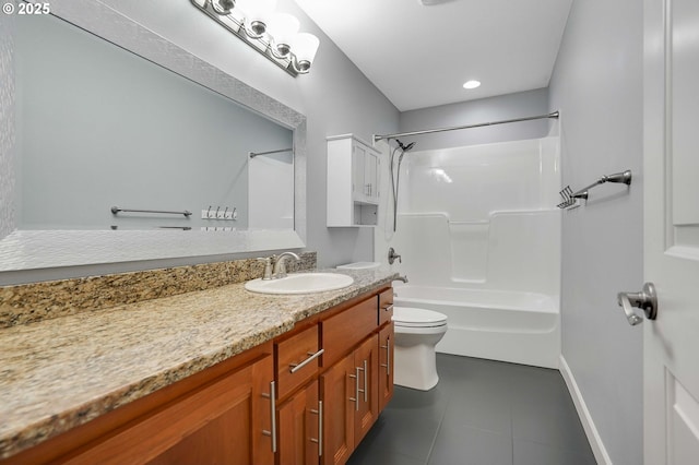 bathroom featuring tile patterned flooring, vanity, toilet, baseboards, and shower / tub combination