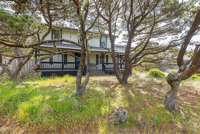 1201 NW Bayshore Dr, Waldport, OR 97394 - view of front facade featuring a porch