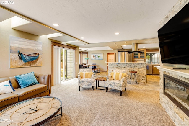 1201 NW Bayshore Dr, Waldport, OR 97394 - living area with light colored carpet, recessed lighting, and a glass covered fireplace
