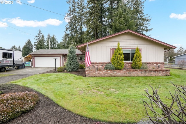 view of front of house with driveway, an attached garage, a front lawn, and brick siding