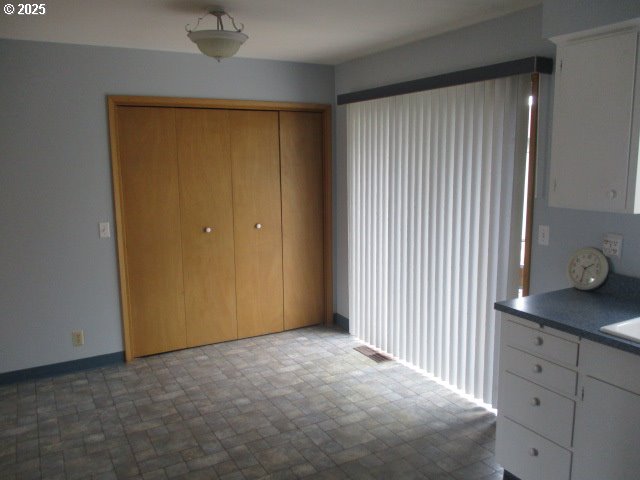 1210 Alder St, Elgin, OR 97827 - interior space featuring baseboards and visible vents
