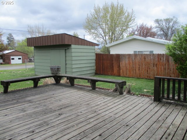 1210 Alder St, Elgin, OR 97827 - deck with a shed, an outbuilding, and fence