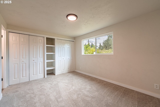 823 20th St, Springfield, OR 97477 - unfurnished bedroom featuring carpet floors and two closets
