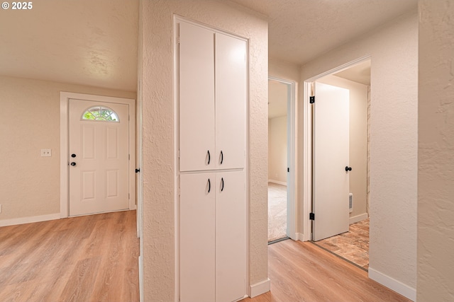 823 20th St, Springfield, OR 97477 - corridor featuring light wood-style floors and a textured wall