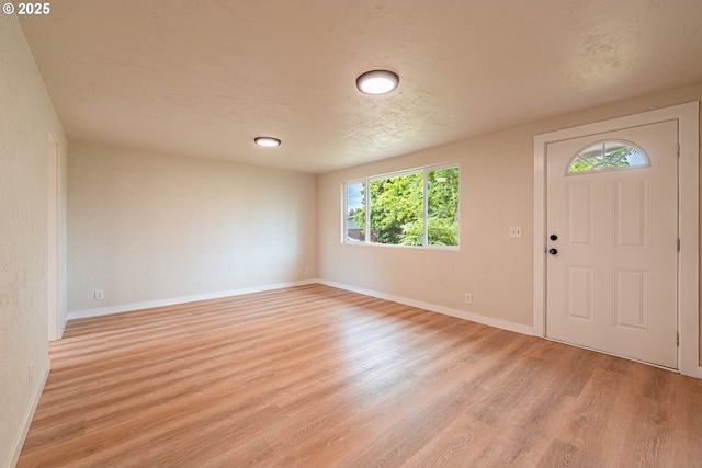 823 20th St, Springfield, OR 97477 - foyer with light wood-style flooring and a textured ceiling
