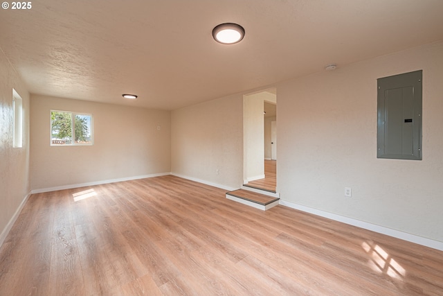 823 20th St, Springfield, OR 97477 - unfurnished room with electric panel, light wood finished floors, and a smoke detector
