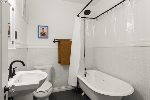 1529 SE Hawthorne Blvd Unit 204, Portland, OR 97214 - full bath featuring toilet, tile walls, a wainscoted wall, and a sink