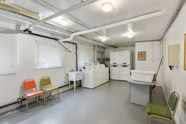 1529 SE Hawthorne Blvd Unit 204, Portland, OR 97214 - community laundry room featuring stacked washer / dryer, a garage, a sink, separate washer and dryer, and electric panel