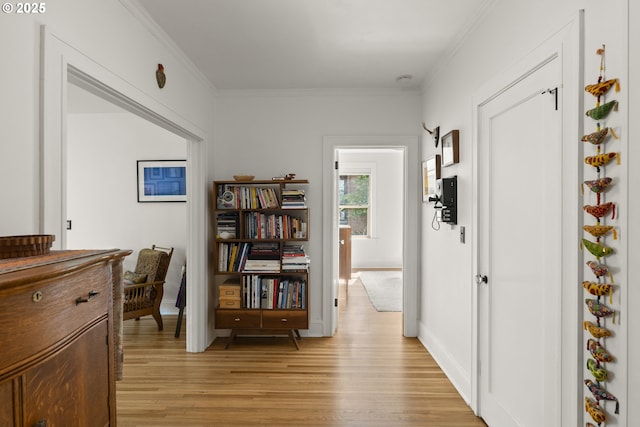 1529 SE Hawthorne Blvd Unit 204, Portland, OR 97214 - hallway featuring crown molding, light wood-type flooring, and baseboards