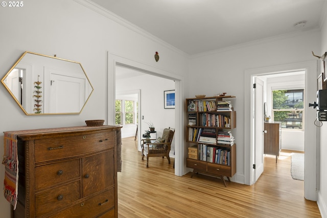 1529 SE Hawthorne Blvd Unit 204, Portland, OR 97214 - living area featuring baseboards, ornamental molding, and light wood-style flooring