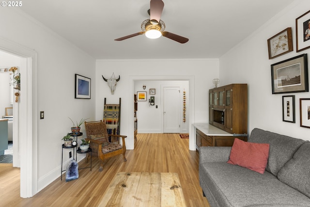 1529 SE Hawthorne Blvd Unit 204, Portland, OR 97214 - living area with ornamental molding, ceiling fan, and light wood-style floors