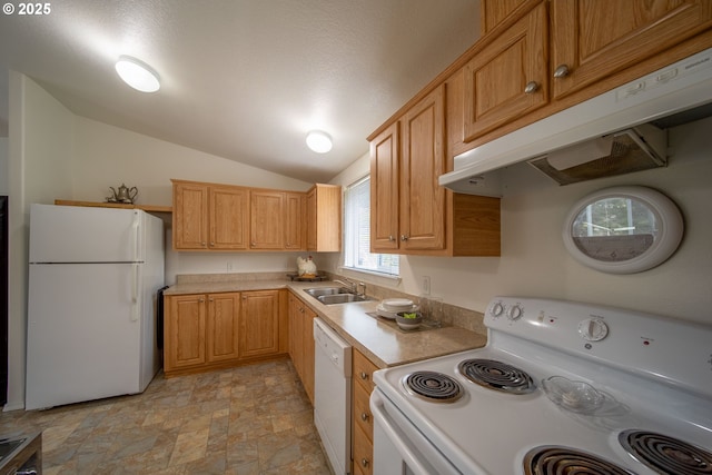 kitchen with white appliances, a sink, light countertops, stone finish floor, and under cabinet range hood