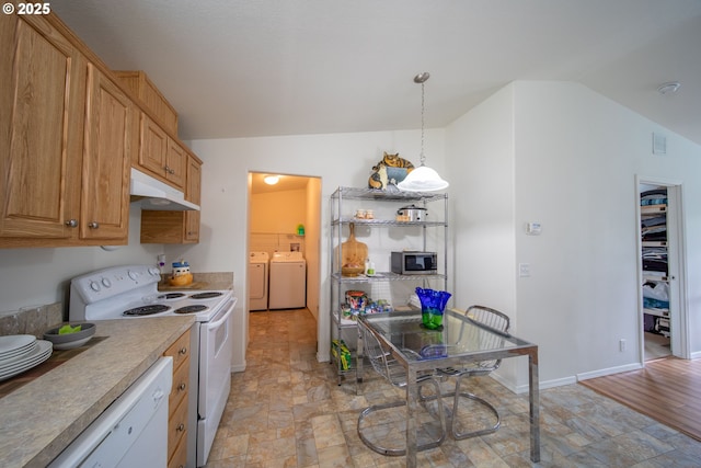 kitchen with white appliances, baseboards, separate washer and dryer, vaulted ceiling, and under cabinet range hood