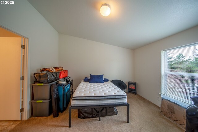 bedroom featuring carpet flooring and lofted ceiling