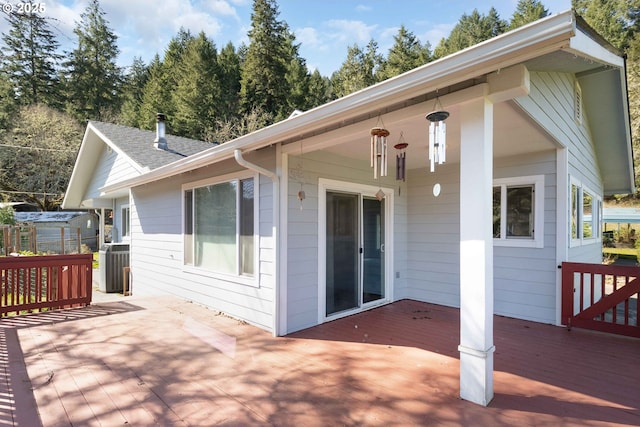 wooden terrace featuring central AC unit