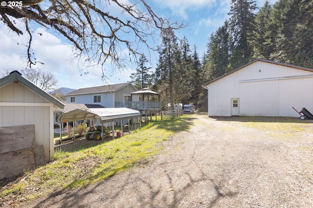 view of road with an outbuilding and driveway