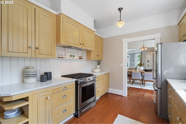 1905 N Sumner St, Portland, OR 97217 - kitchen with stainless steel appliances, open shelves, light brown cabinets, dark wood-type flooring, and light countertops