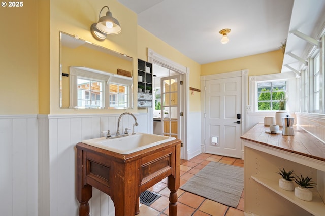 1905 N Sumner St, Portland, OR 97217 - bathroom with a wainscoted wall and tile patterned flooring