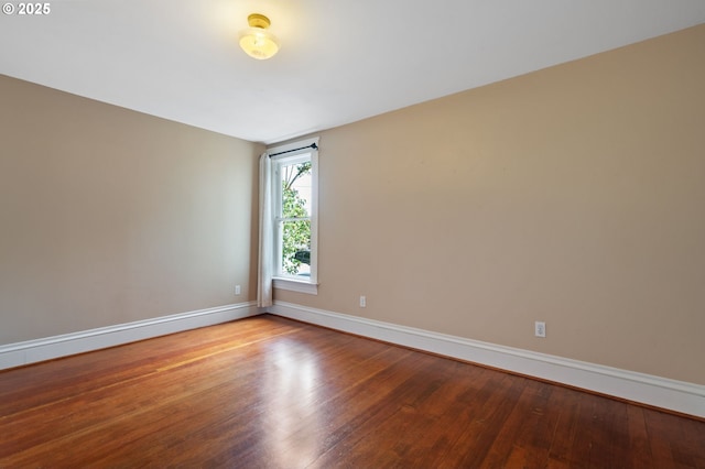 1905 N Sumner St, Portland, OR 97217 - unfurnished room with baseboards and wood-type flooring