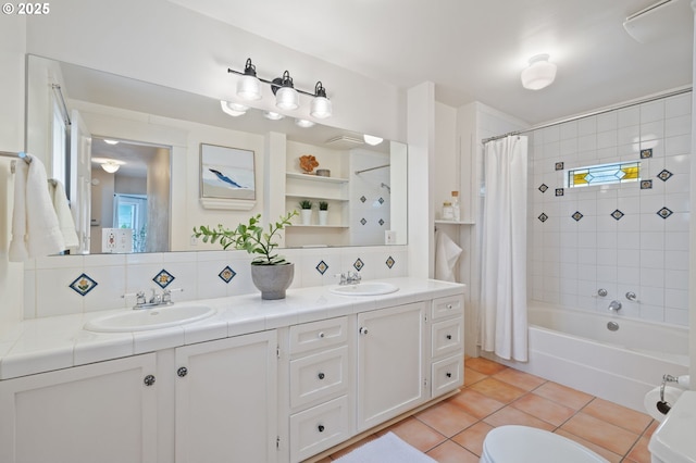 1905 N Sumner St, Portland, OR 97217 - bathroom with shower / bath combination with curtain, double vanity, tile patterned floors, and backsplash