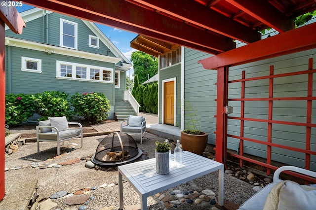 1905 N Sumner St, Portland, OR 97217 - view of patio featuring a fire pit and stairway