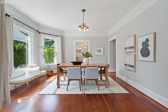 1905 N Sumner St, Portland, OR 97217 - dining space with a chandelier and dark wood-style flooring