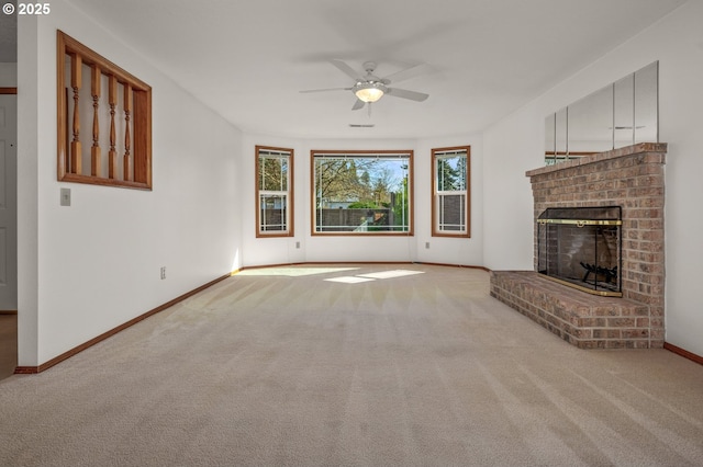 unfurnished living room featuring visible vents, ceiling fan, baseboards, carpet floors, and a fireplace