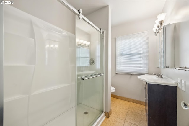 bathroom with toilet, an enclosed shower, tile patterned flooring, and vanity