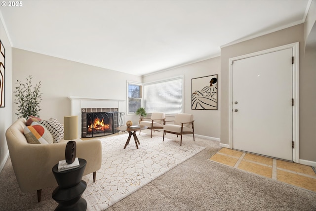 living room with a fireplace, ornamental molding, and carpet floors