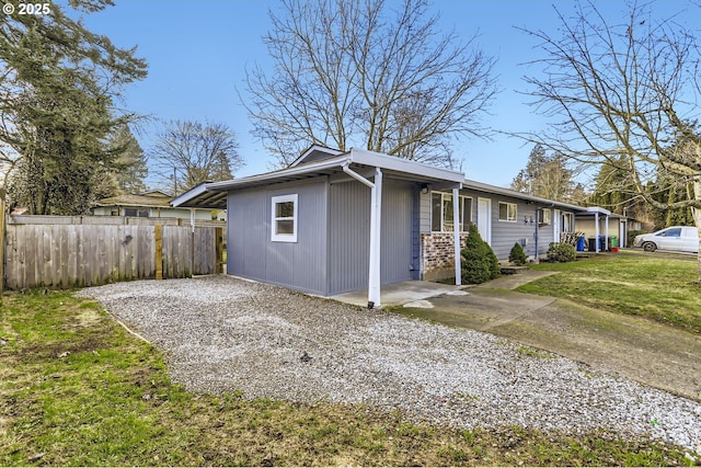 view of side of property featuring a yard