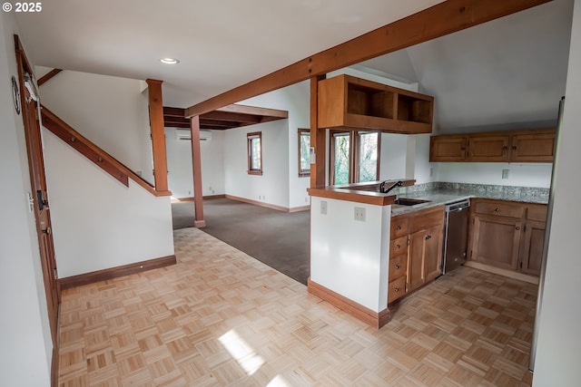 kitchen with light parquet floors, a wall mounted AC, dishwasher, and beamed ceiling