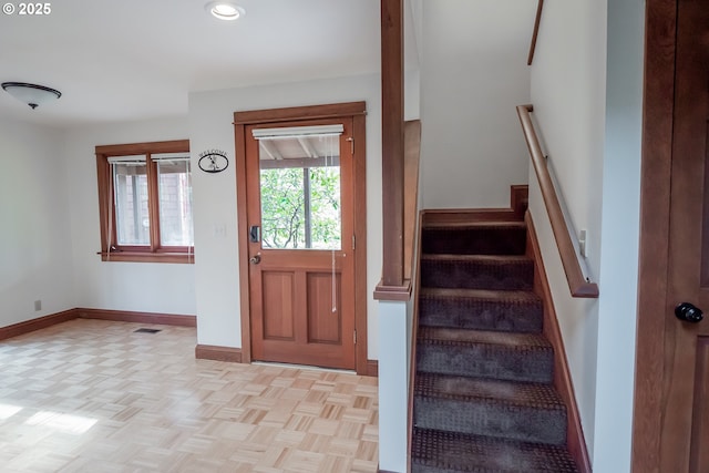 foyer entrance with light parquet floors