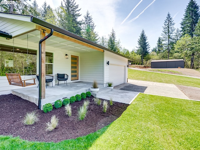 back of property with a porch and a lawn