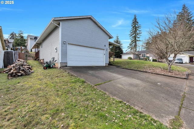 view of side of home featuring a garage and a yard