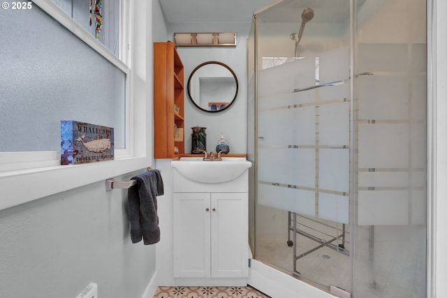 full bathroom featuring a shower stall and vanity