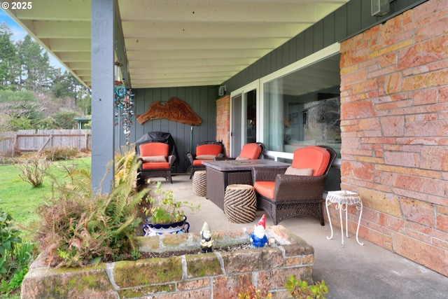 view of patio featuring fence