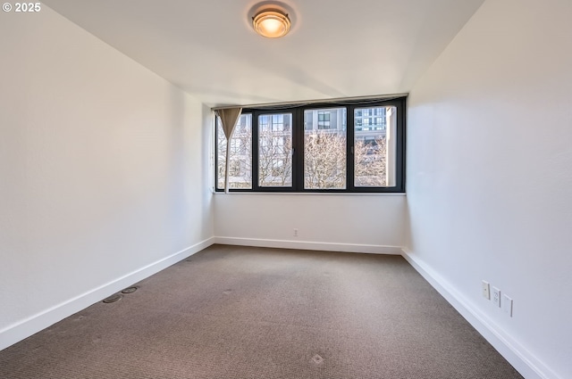 255 SW Harrison St Unit 3C, Portland, OR 97201 - unfurnished room featuring dark colored carpet and baseboards
