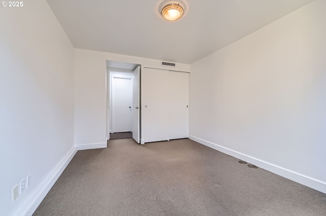 255 SW Harrison St Unit 3C, Portland, OR 97201 - unfurnished bedroom with carpet flooring, baseboards, and a closet