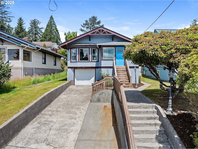 1225 Alameda Ave, Astoria, OR 97103 - view of front of property featuring concrete driveway, stairway, and an attached garage