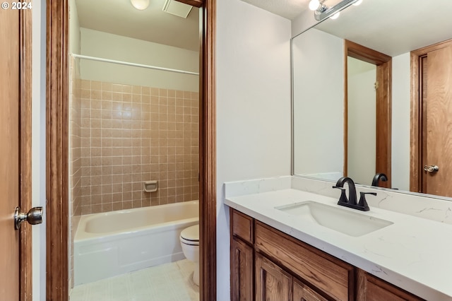 bathroom with shower / bath combination with curtain, vanity, and toilet