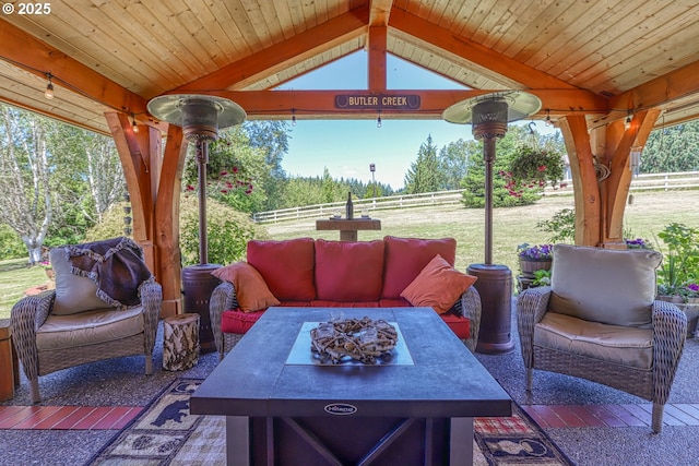 view of patio / terrace featuring a fire pit and a gazebo