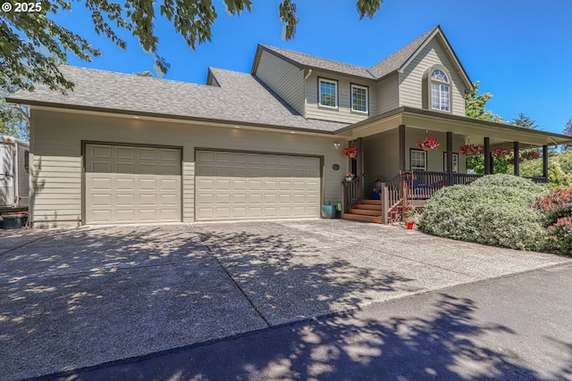 view of front of house with a garage and covered porch