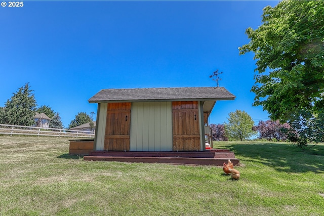 view of outdoor structure with a lawn