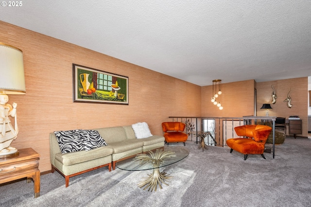 living room with a textured ceiling and carpet