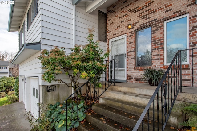 view of exterior entry featuring a garage