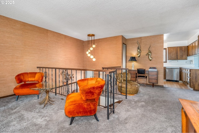 living area featuring a textured ceiling and carpet flooring